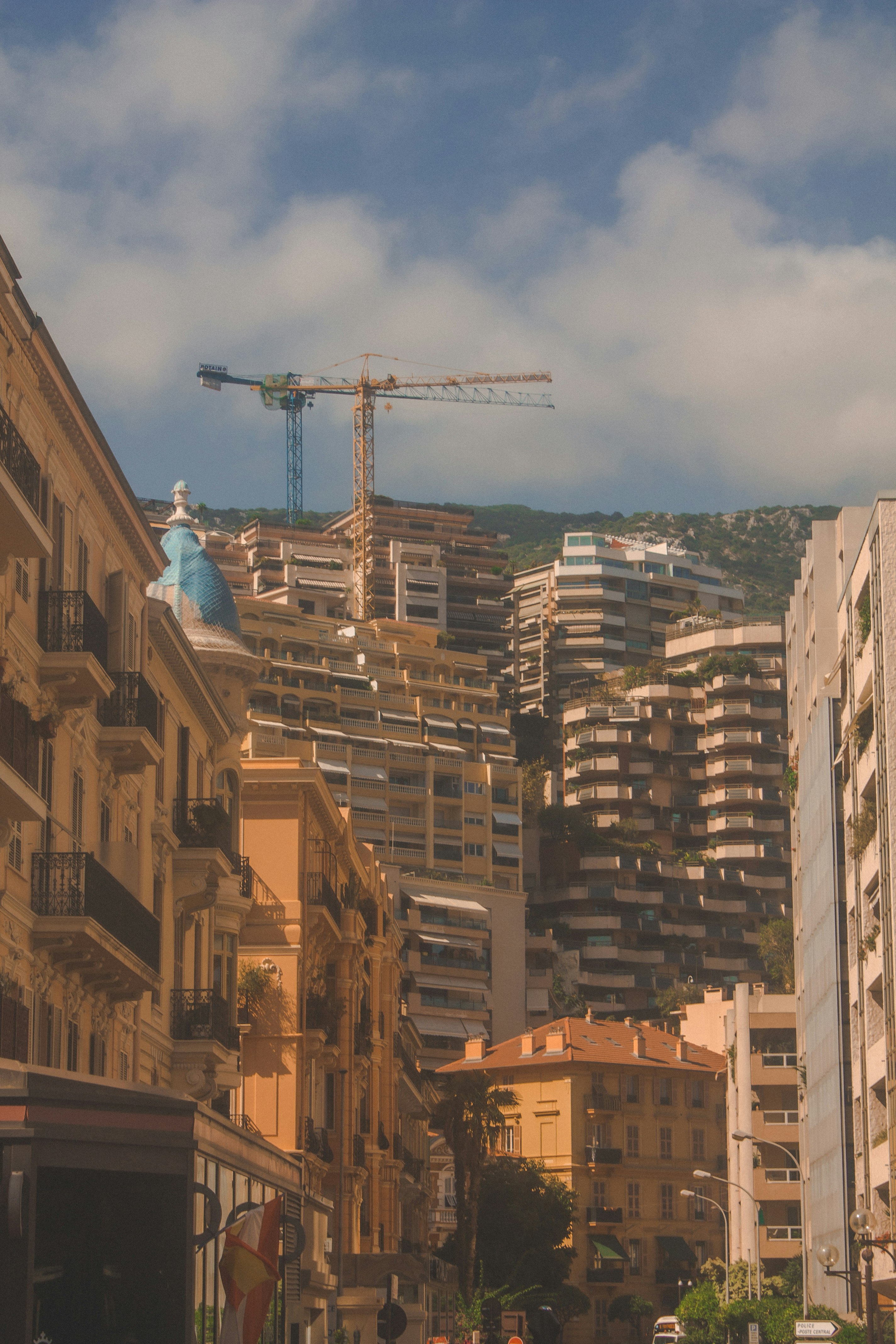 brown concrete building under white clouds during daytime